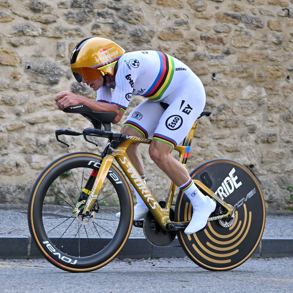 Remco Evenepoel on a time-trial bike in the world champion’s rainbow jersey