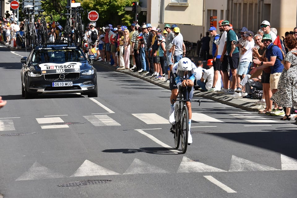 Enric Mas riding a time-trial bike during the 2025 Tour de France stage in Caen