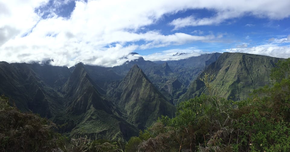 Steep, green volcanic ridges and valleys under cloud in the Cirque de Mafate on Réunion